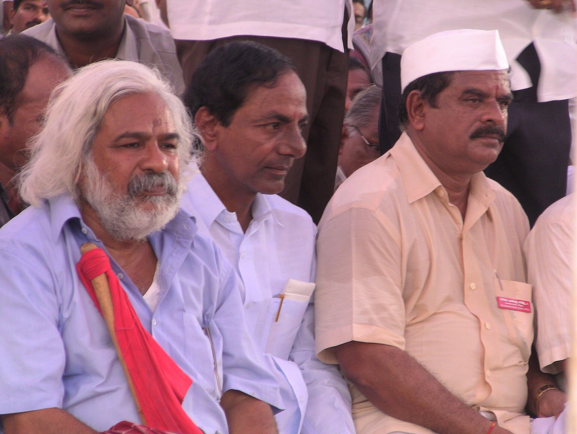 KCR seated between balladeer Gaddar and other leaders at a Telangana agitation gathering