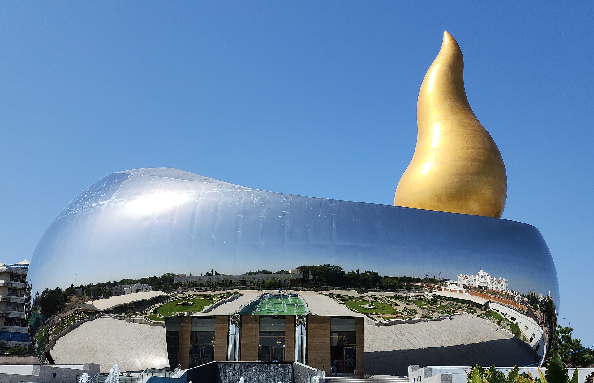 The Telangana Martyrs Memorial, a steel stupa with golden flame, at Hussain Sagar